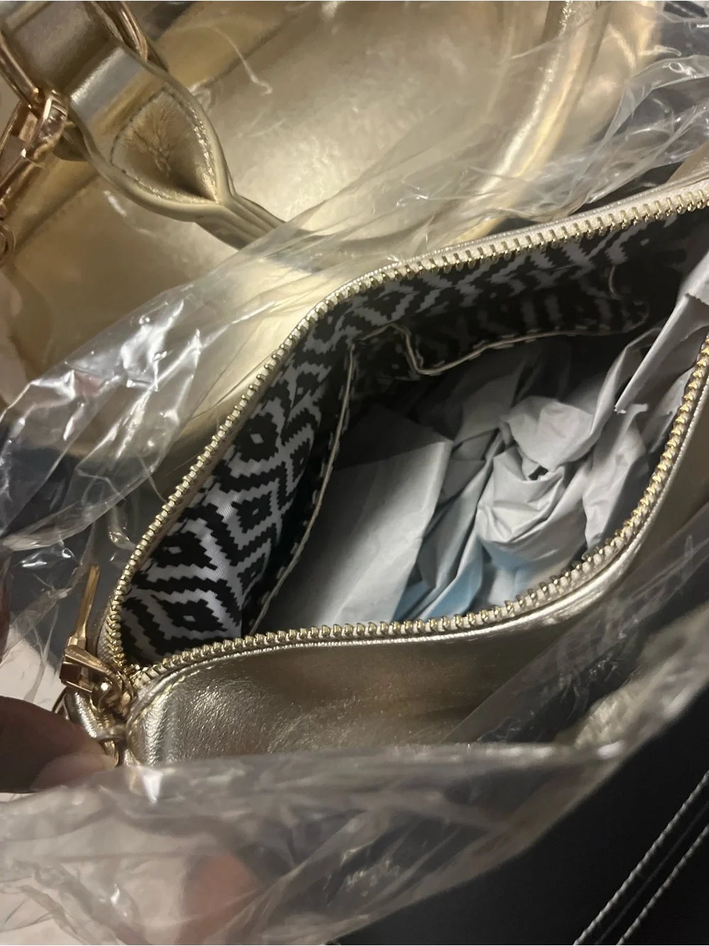 Gold clear two and one purse with handles and gold straps.